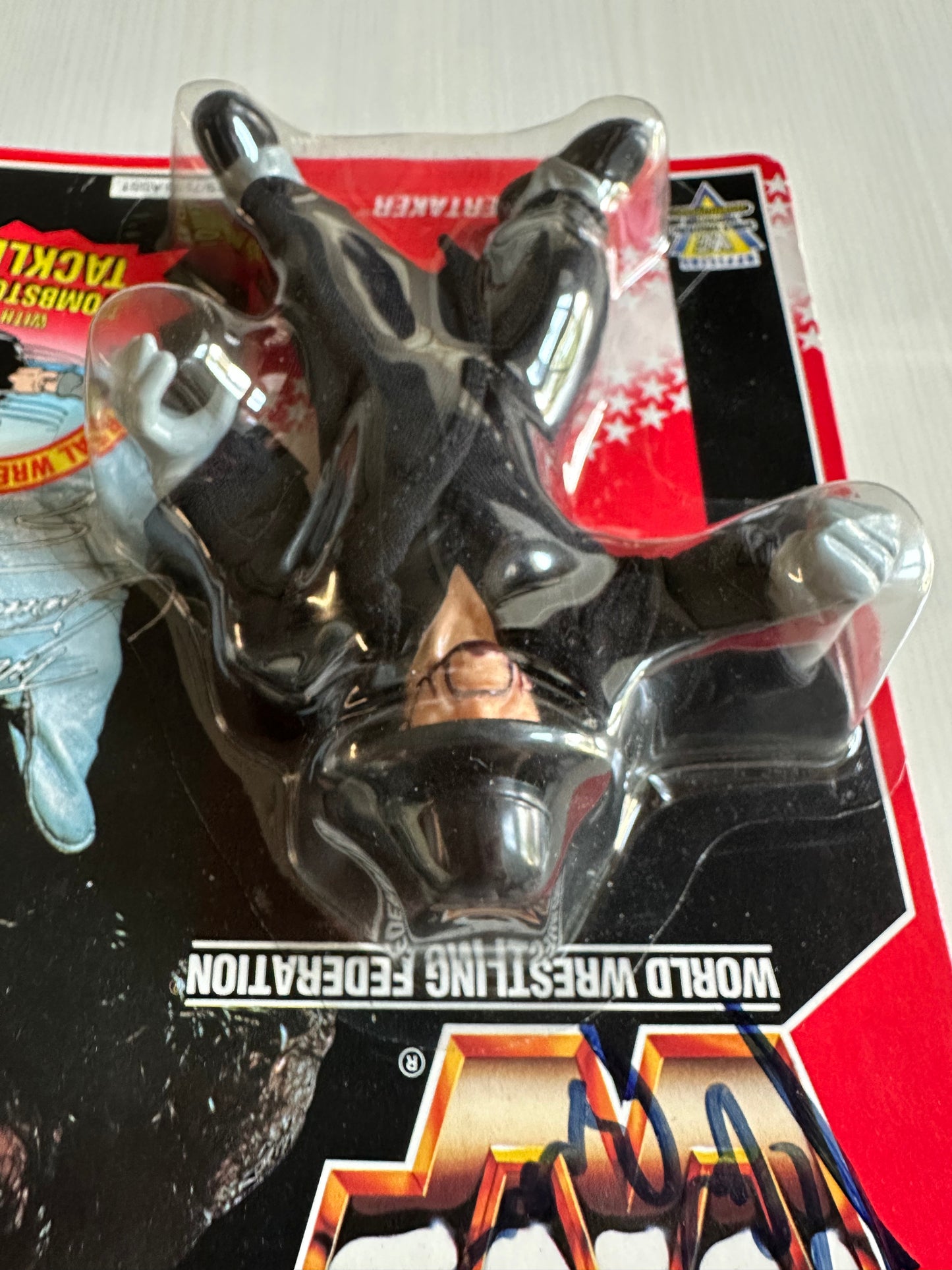 The Undertaker Series 8 WWF Hasbro MOC figure (signed by Paul Bearer)